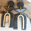 PERSONA Earrings.  Textured Black Polymer Clay Arch earrings with brass dangles